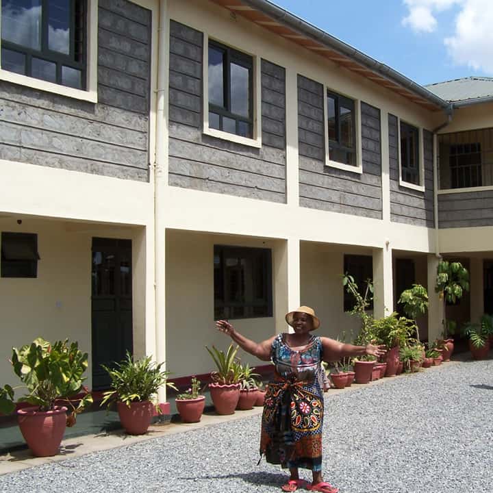 Rev. Nelly outside the new Wadada Children's Home