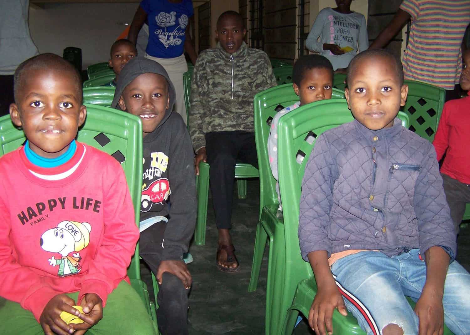 Wadada Kids Sit Together at the Children's Center